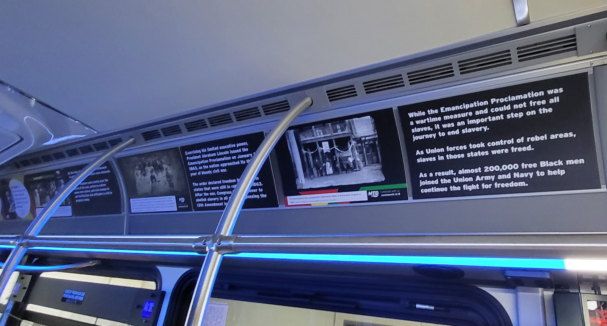 Several posters are shown inside the Juneteenth Bus, which is a mobile history exhibit to teach about the history and significance ofof Juneteenth.